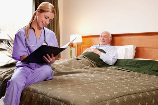 Female nurse preparing the medical report of a patient