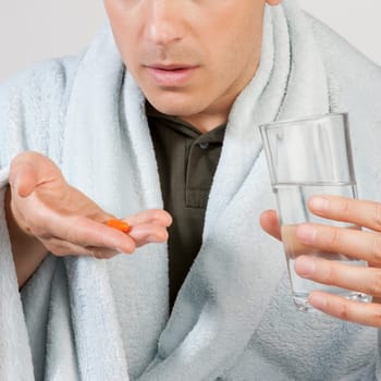 Man taking medicine