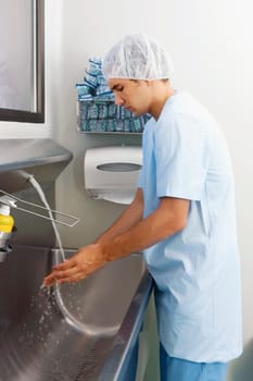 Surgeon washing hands