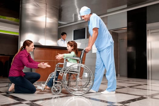 Woman assisting her daughter to walk