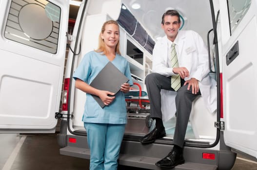 Doctor with a female nurse in an ambulance