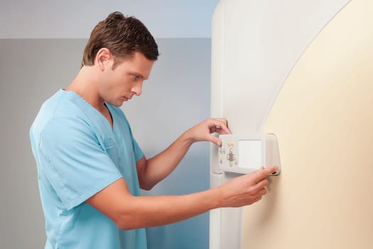 Technician operating an MRI scanner