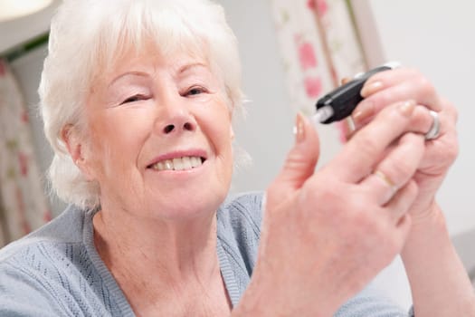 Woman testing her blood sugar level
