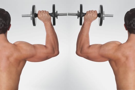 Rear view of two men exercising with dumbbells