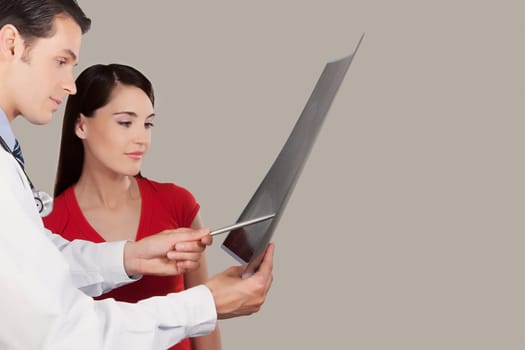 Doctor explaining x_ray report to a patient