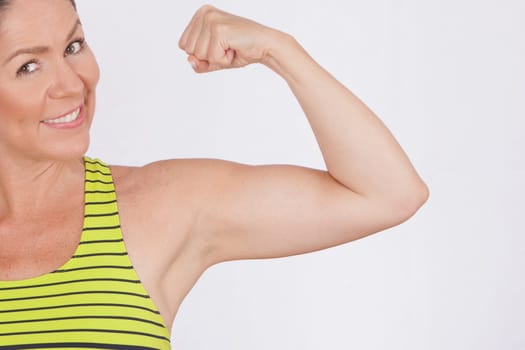 Portrait of a woman flexing muscles