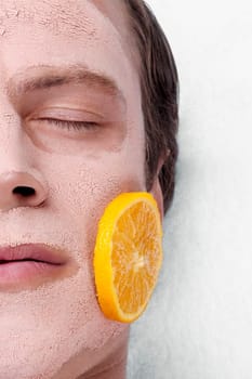 Orange slices on a manŽs face