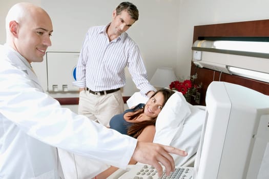 Pregnant woman going through an ultrasound scan