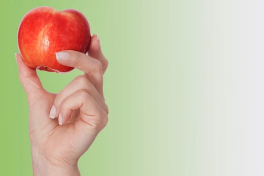PersonŽs hand holding an apple