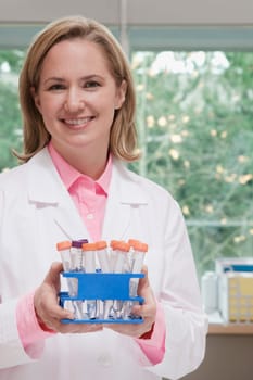 Female doctor holding medical samples in a laboratory