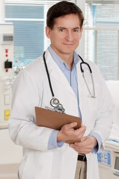 Doctor holding a clipboard and smiling