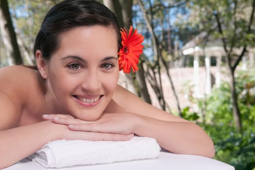 Portrait of a woman lying on a massage table and smiling