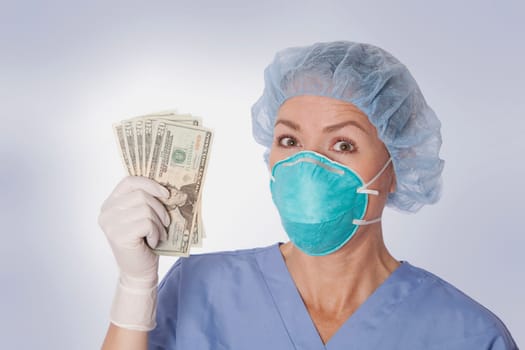 Female surgeon holding currency notes