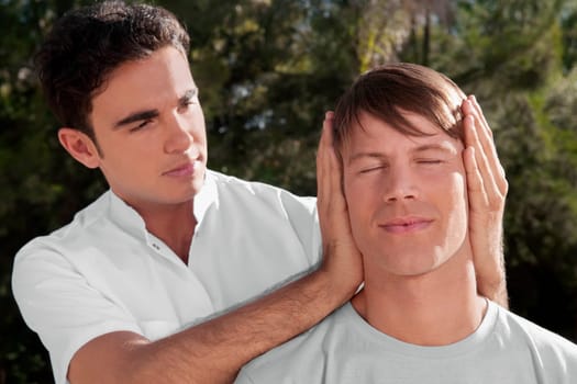 Man receiving a head massage