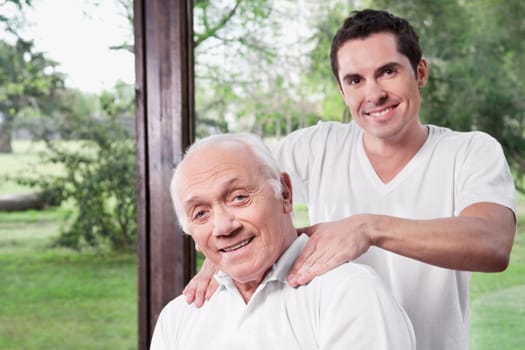Massage therapist massaging a manŽs neck