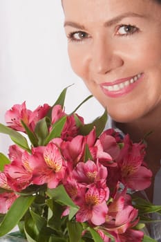 Portrait of a woman with bunch of flowers