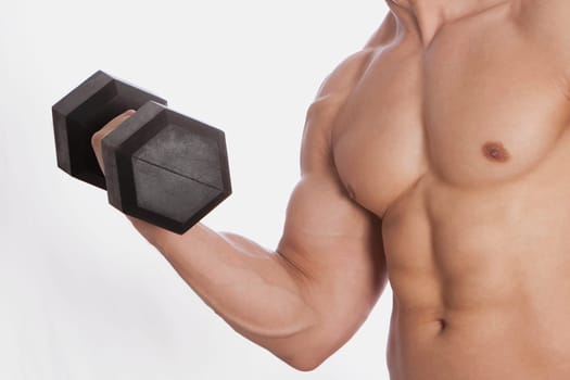 Mid section view of a man exercising with a dumbbell