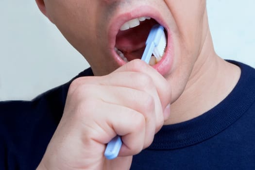 Man brushing teeth