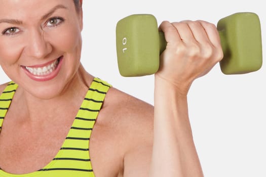 Portrait of a woman exercising with a dumbbell