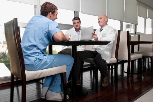 Doctors discussing in a cafeteria
