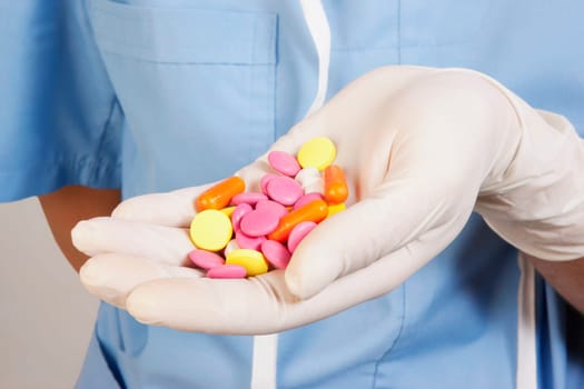 PersonŽs hand holding pills