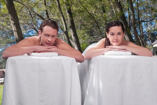 Couple lying on massage tables
