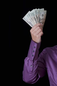 PersonŽs hand holding fanned out currency notes