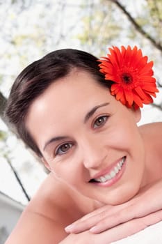 Portrait of a woman lying on a massage table and smiling