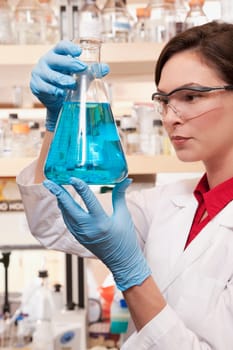 Female doctor holding a conical flask in a laboratory