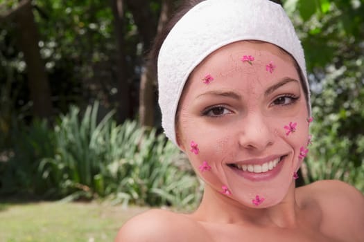 Woman receiving facial treatment