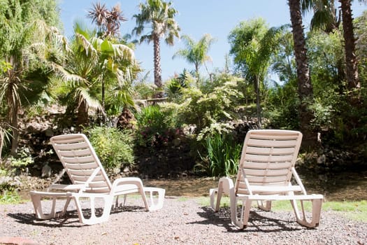 Two lounge chairs in a tourist resort