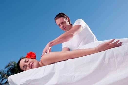 Woman receiving back massage