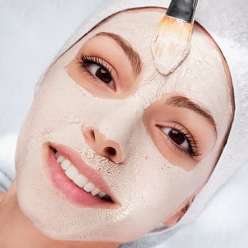 Woman applying face pack