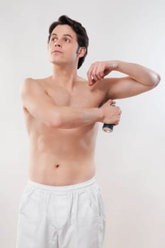 Man applying deodorant
