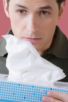 Man holding a tissue paper box