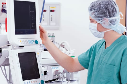 Doctor working on a cardiac monitor screen