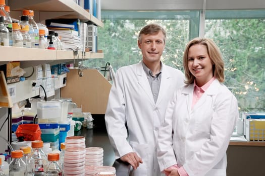 Portrait of two doctors smiling in a laboratory