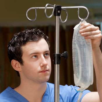 Doctor checking a saline drip