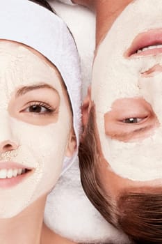 Couple with face pack on their faces