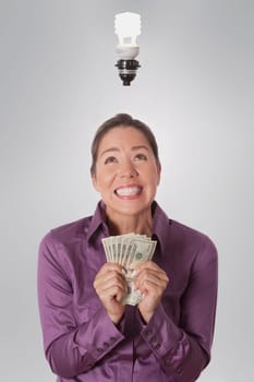 Woman holding currency notes