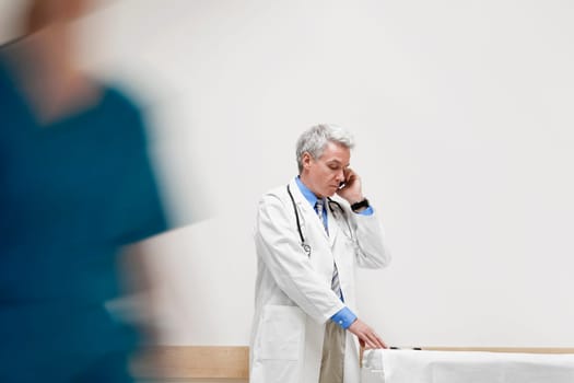 Doctor talking on a mobile phone