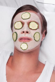 Cucumber slices on a manŽs face