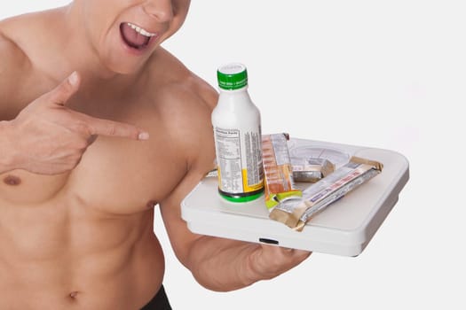 Man holding food supplements and laughing