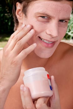 Man applying face pack