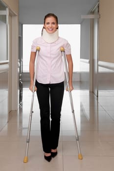 Patient walking with the help of crutches