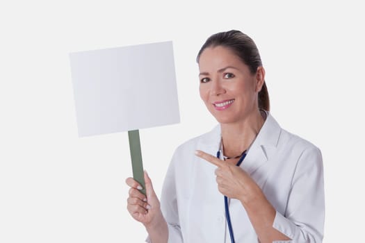 Female doctor holding a blank placard