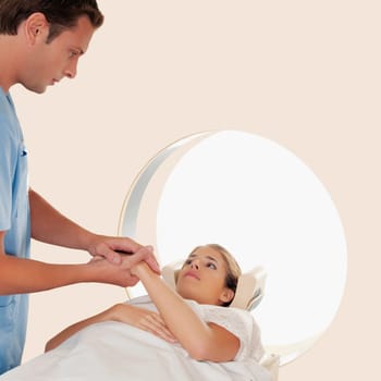 Doctor consoling a patient before an MRI scan
