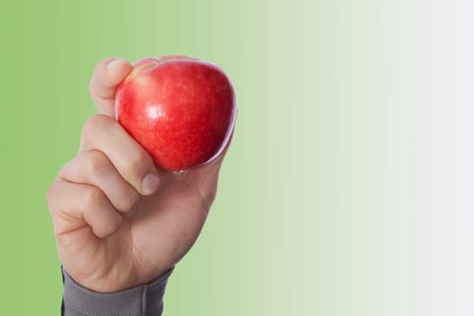 PersonŽs hand holding an apple