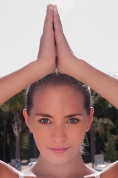 Portrait of a woman in prayer position