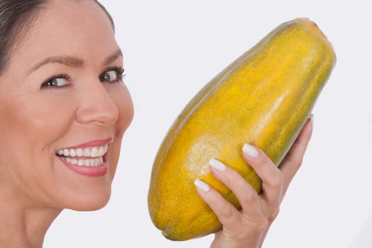 Woman holding a papaya